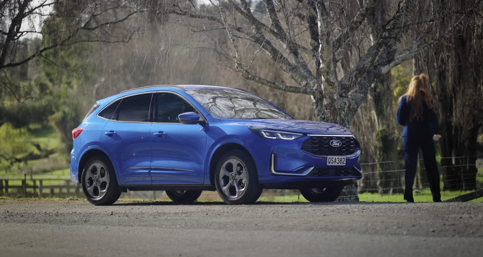 Emergency towing preparation - professional SUV rescue service Blue SUV being prepared for emergency towing service by professional operator